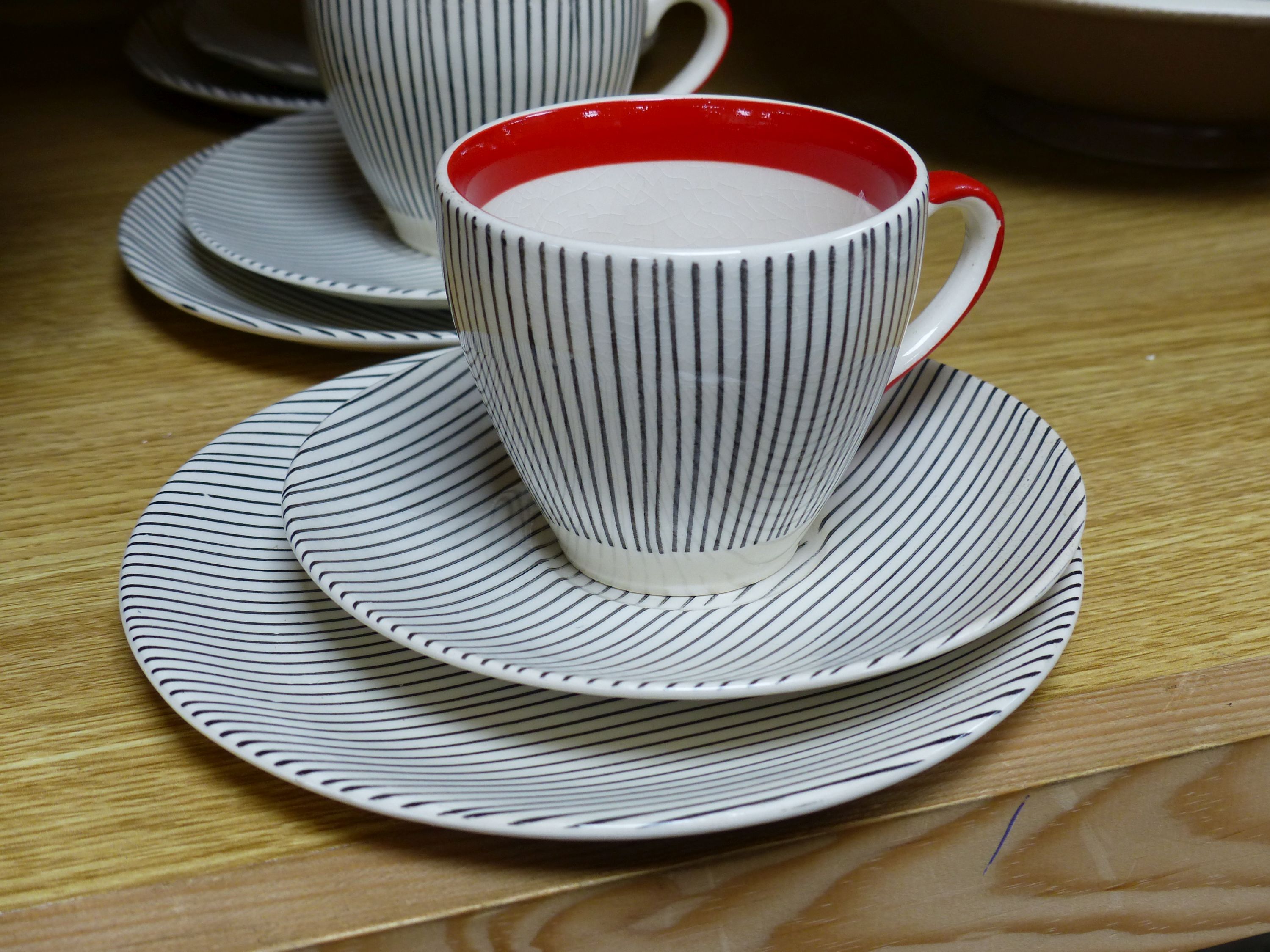 A Poole pottery dish and a set of six Broadhurst Harlem cup, saucers and plates